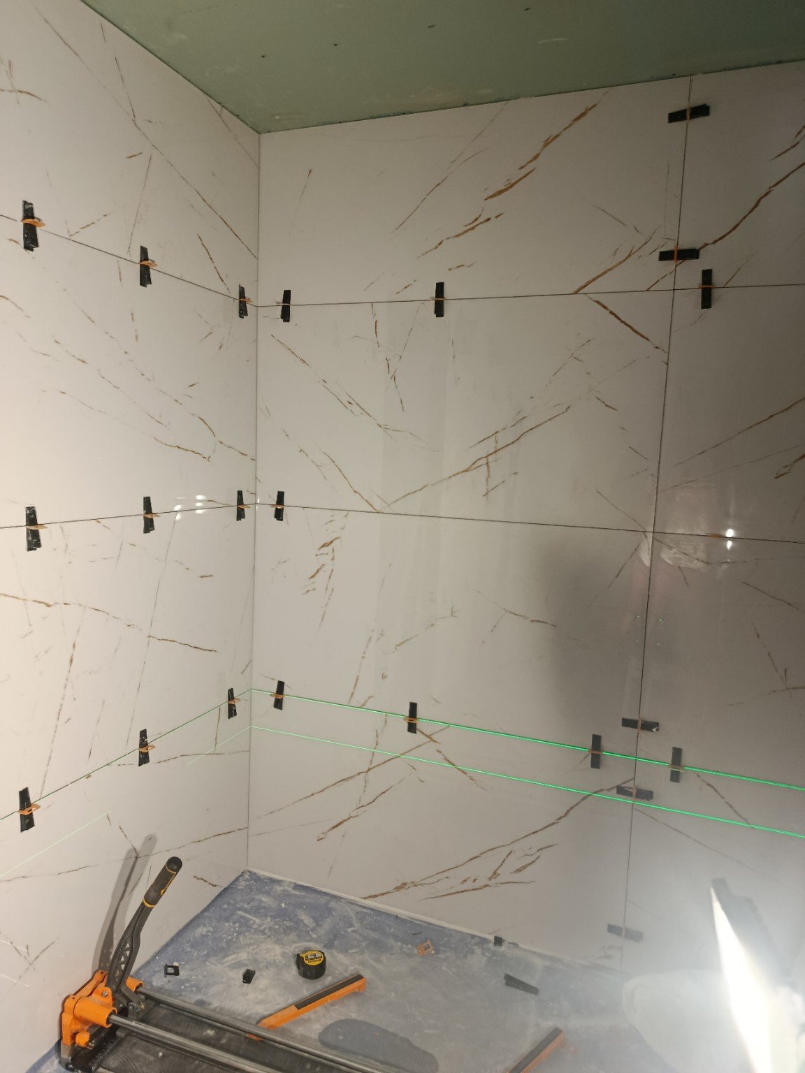 Large-format wall tiles in bathroom