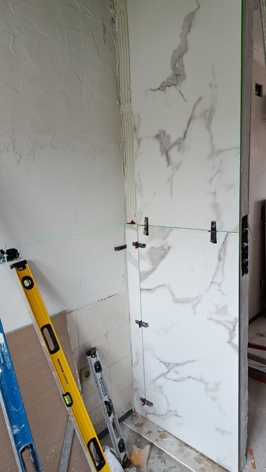 Large-format marble-effect tile installation